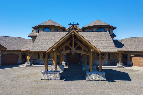 Rustic-River-Calgary-Alberta-Canadian-Timberframes-front-entry-trusses