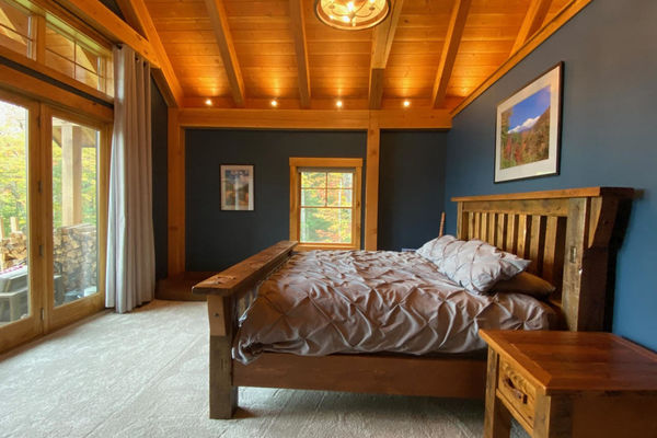 White-Mountain-Timber-Home-Canadian-Timberframes-New-Hampshire-Completed-Bedroom